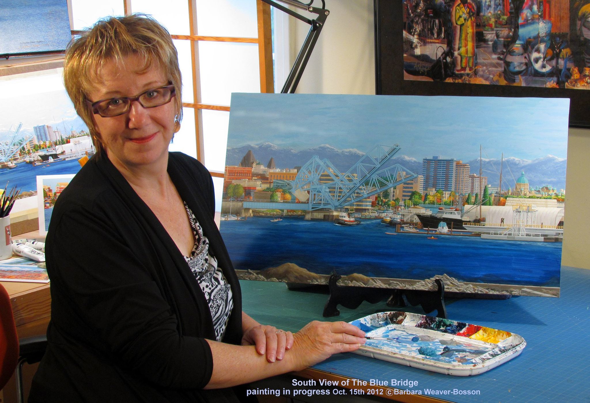 Barbara Weaver-Bosson 2012 with her painting in progress Looking South to the Johnson Street Bridge, Victoria B.C.